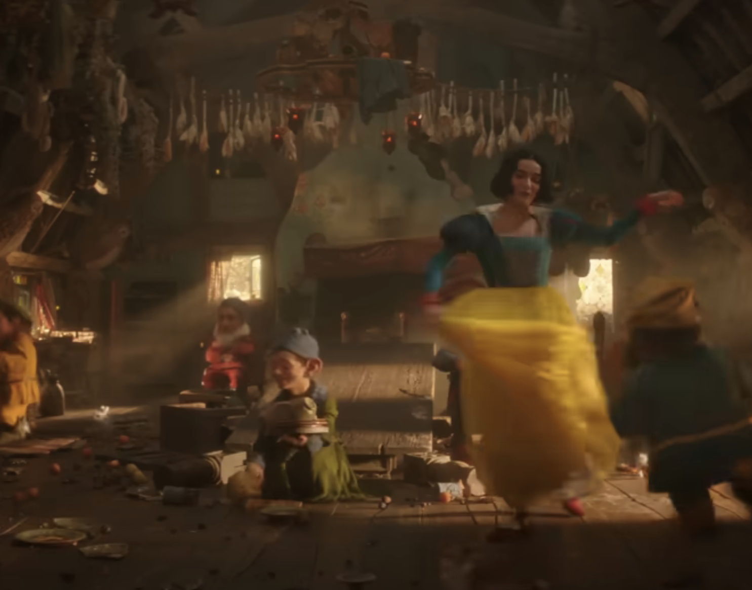 Snow White and seven dwarfs dance and work in a cluttered cottage with hanging herbs and dim lighting