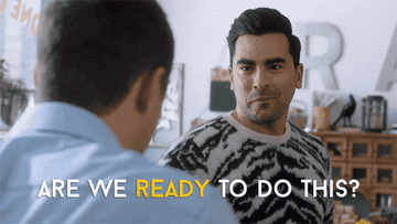 David Rose and another character exchange determined looks. Text reads, "ARE WE READY TO DO THIS?"