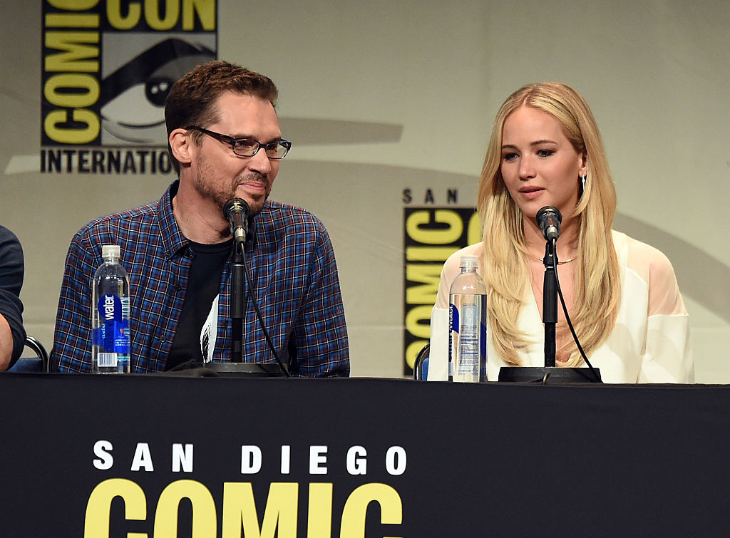 Bryan Singer and Jennifer Lawrence speaking at a panel at San Diego Comic-Con International