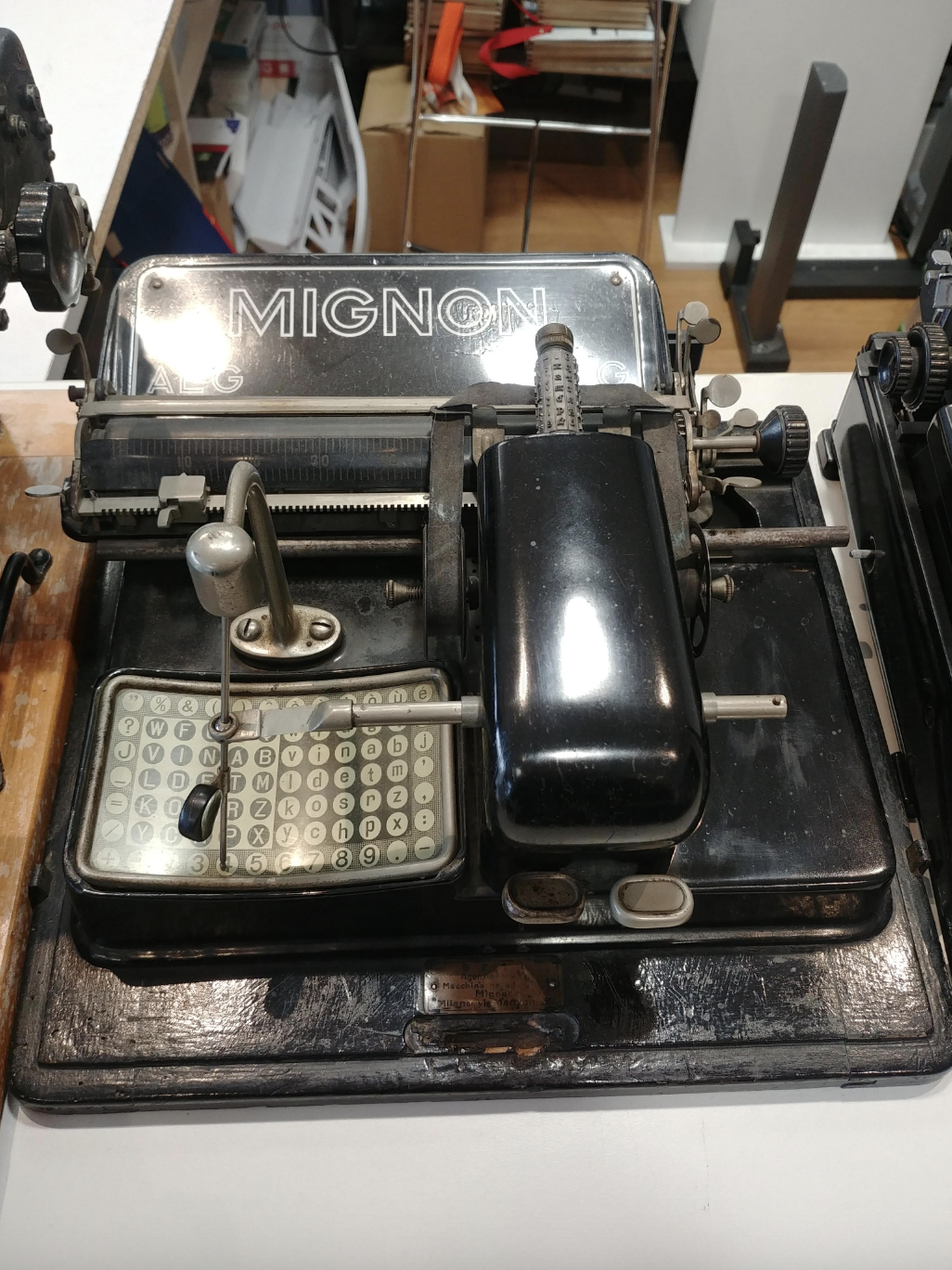 Close-up of a vintage typewriter with "MIGNON" written on the top section