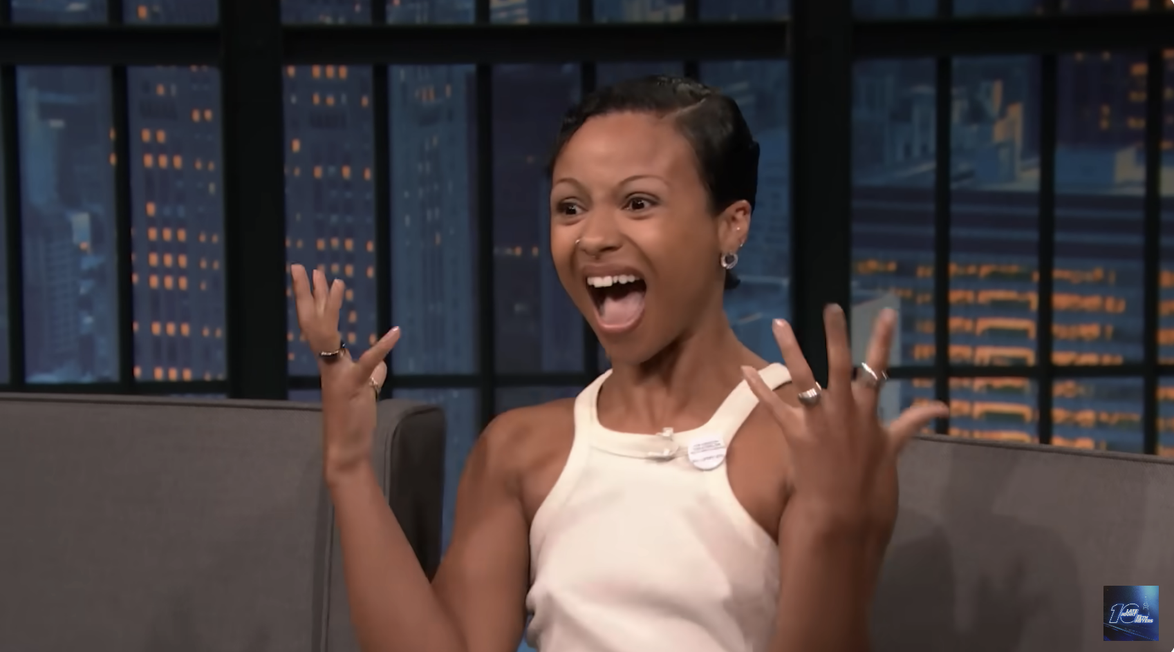 Person excitedly talking on a talk show set