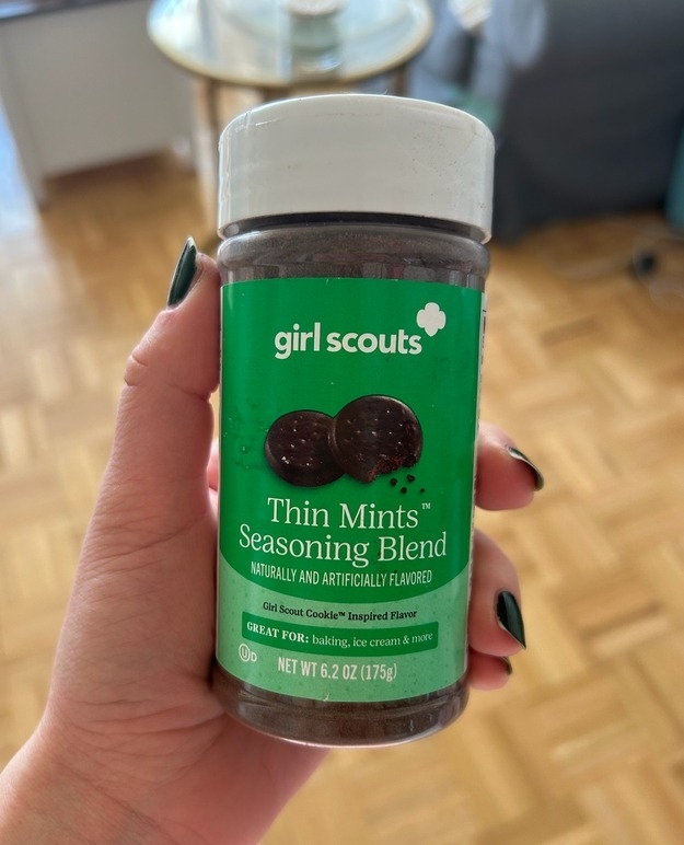 Hand holding a jar of Girl Scouts Thin Mints Seasoning Blend, which is inspired by the Girl Scout Cookie™