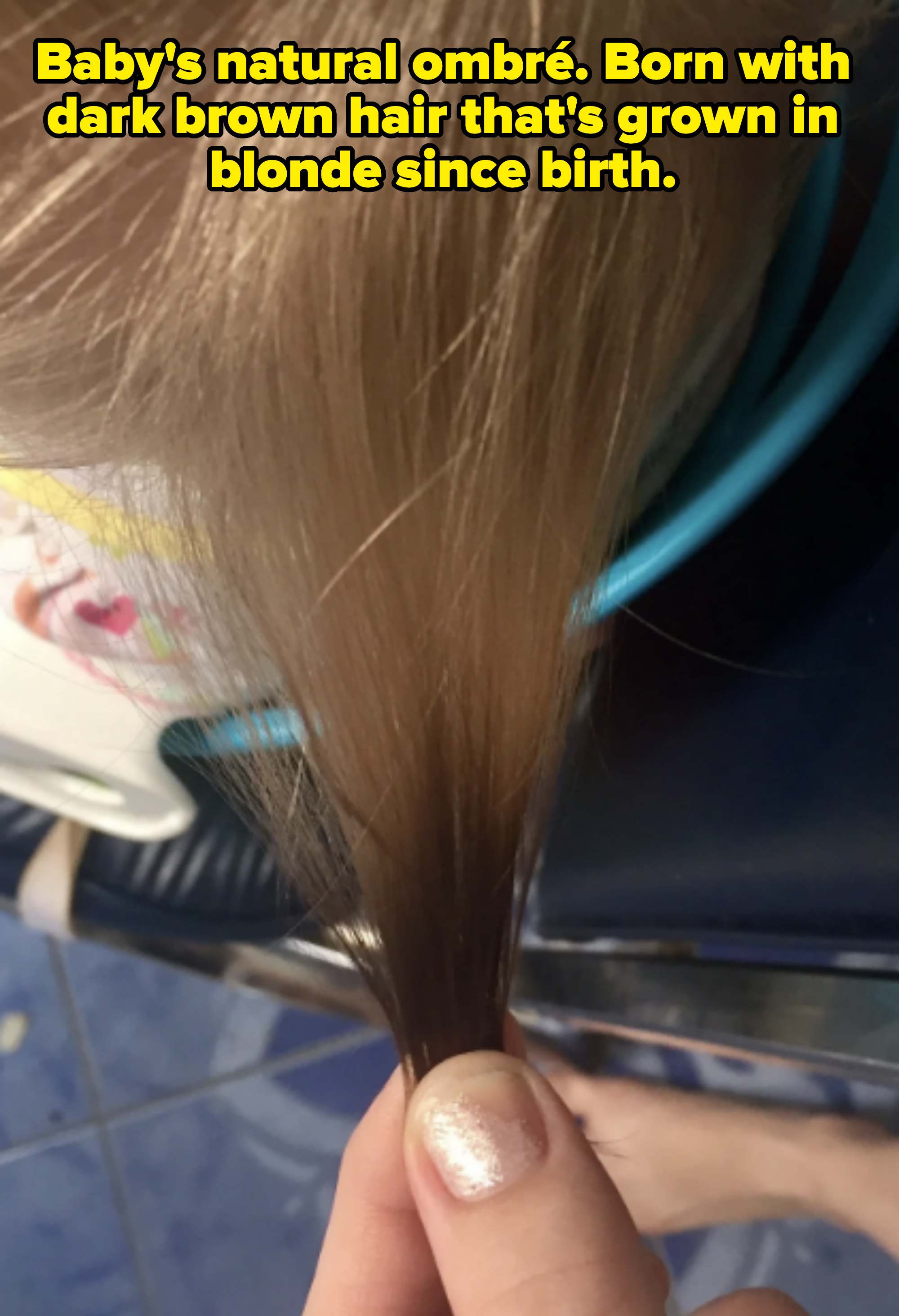 Close-up of wet hair being held by a person's hand during a hair treatment