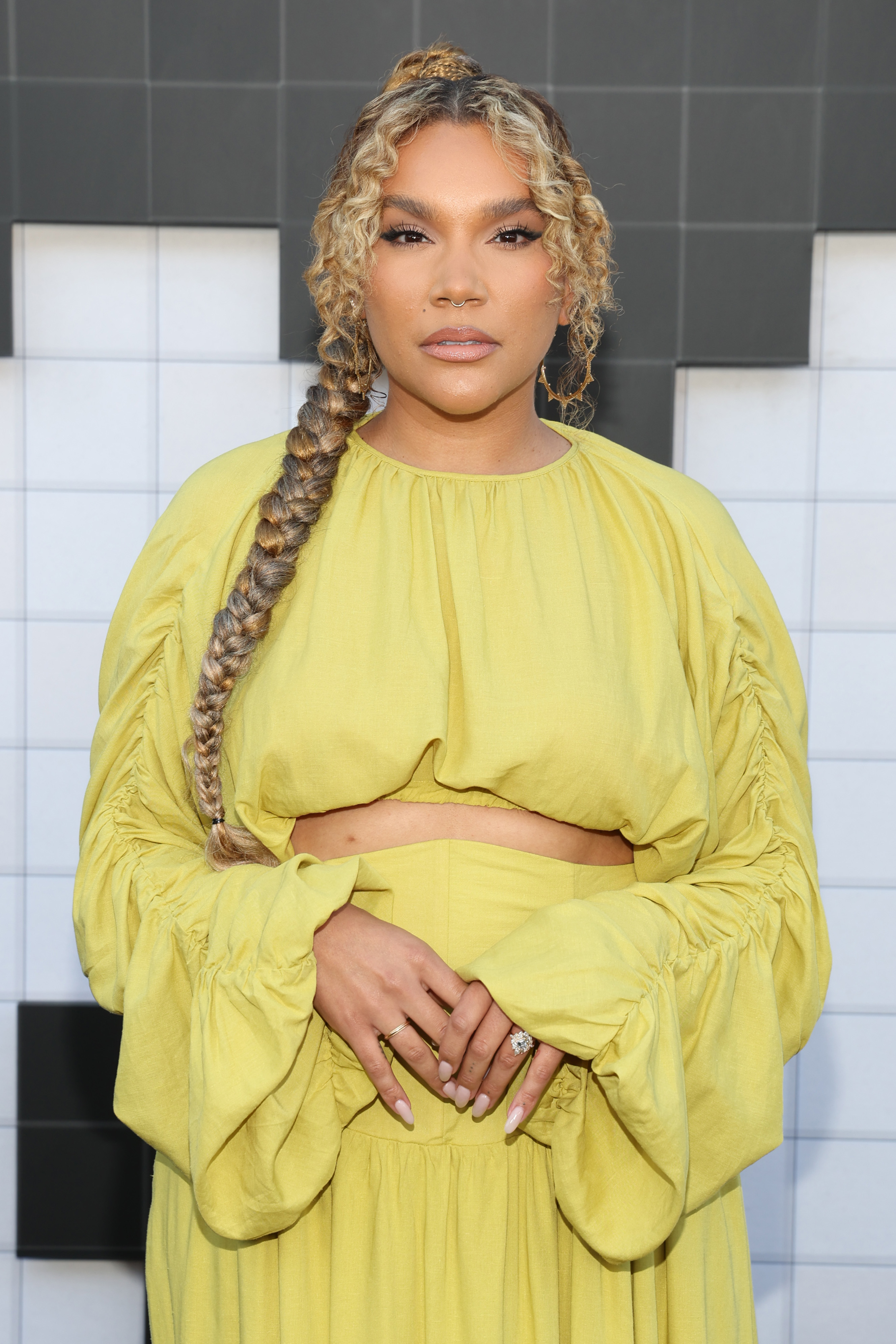 Emmy Raver-Lampman wearing a yellow gown at the premiere of "The Umbrella Academy"