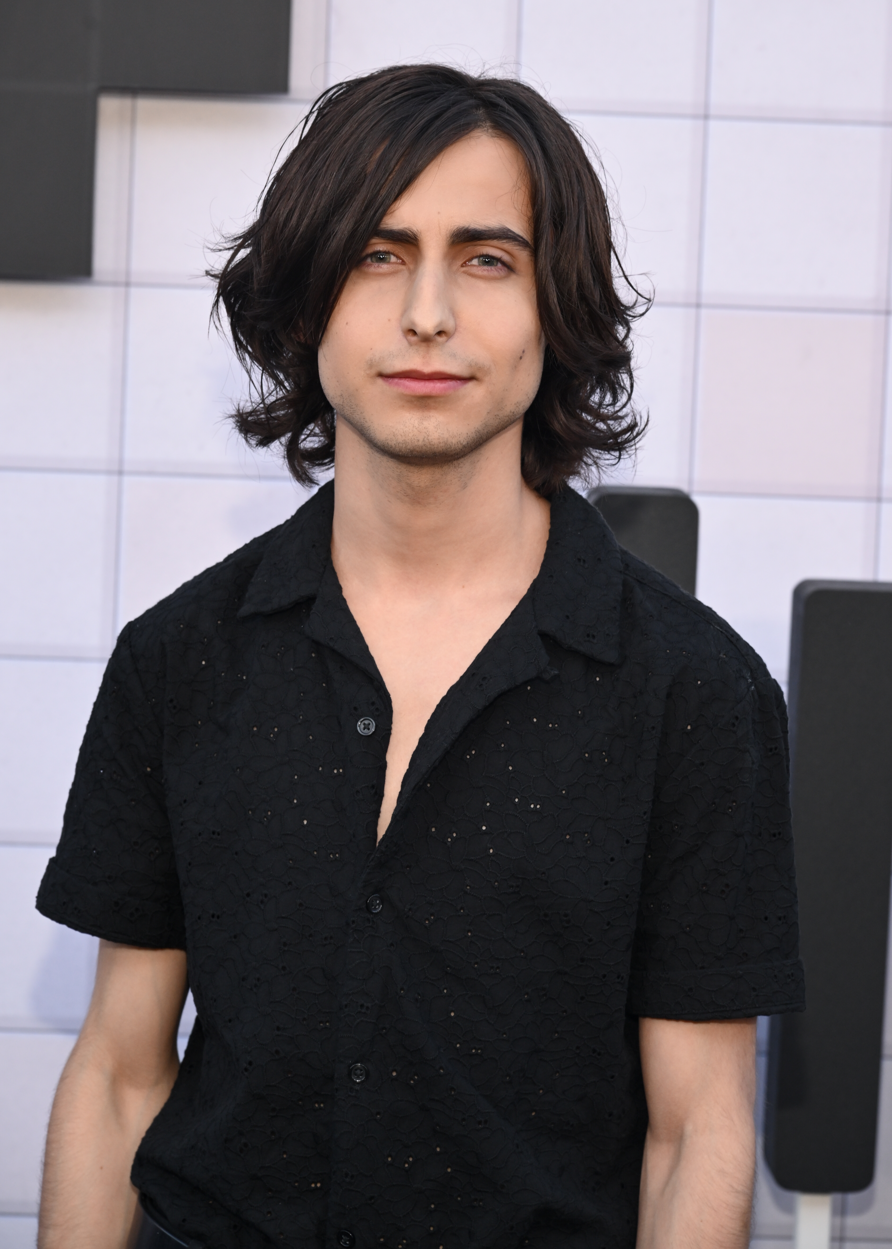 Aidan Gallagher wearing a black button-up shirt at the premiere of "The Umbrella Academy"