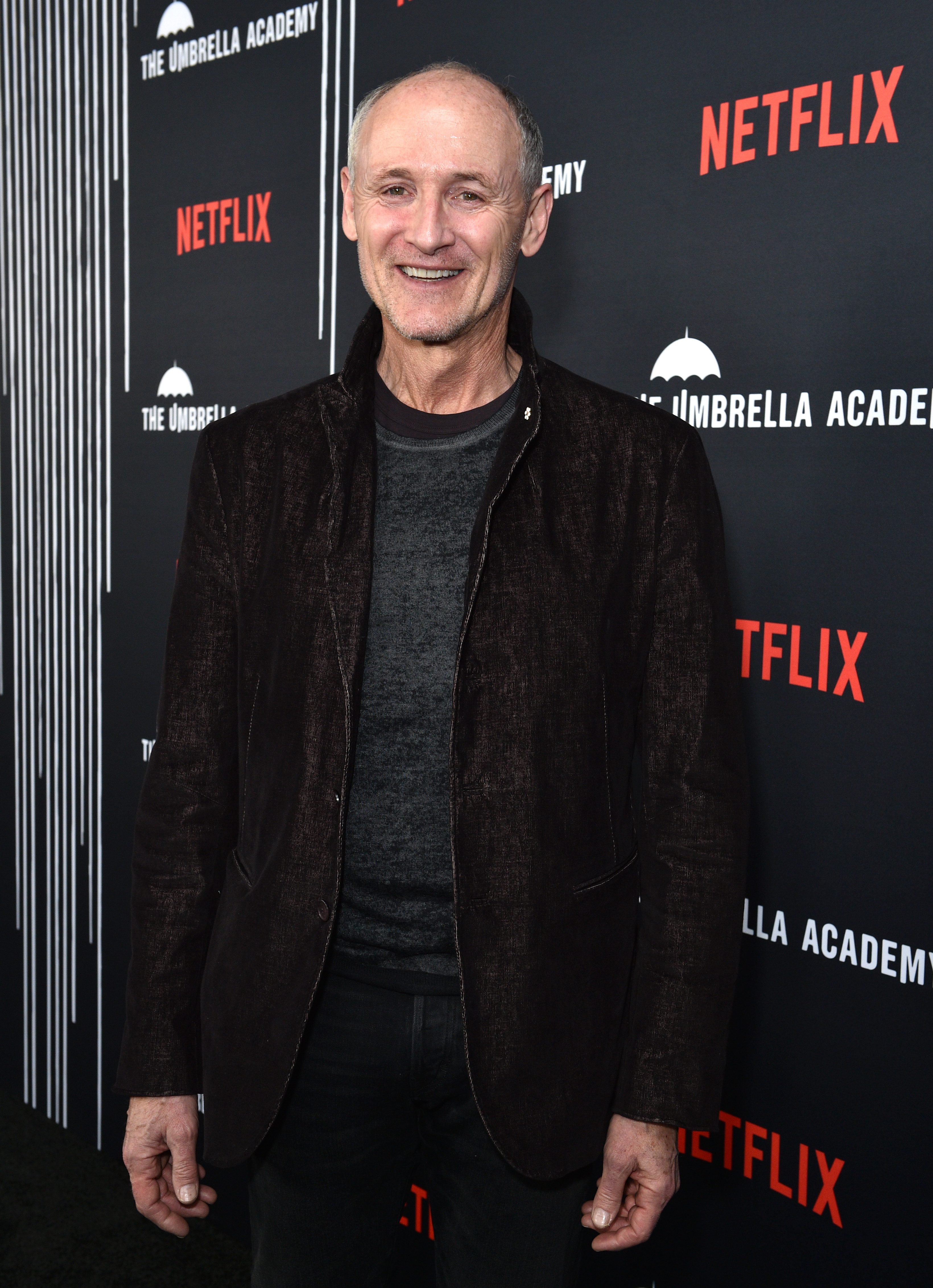 Colm Feore at "The Umbrella Academy'" event, wearing a dark jacket over a gray shirt