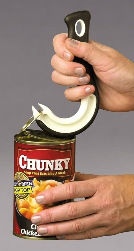 Person demonstrates using a adaptive device to open a can of Chunky chicken soup with an easy-open pop-top