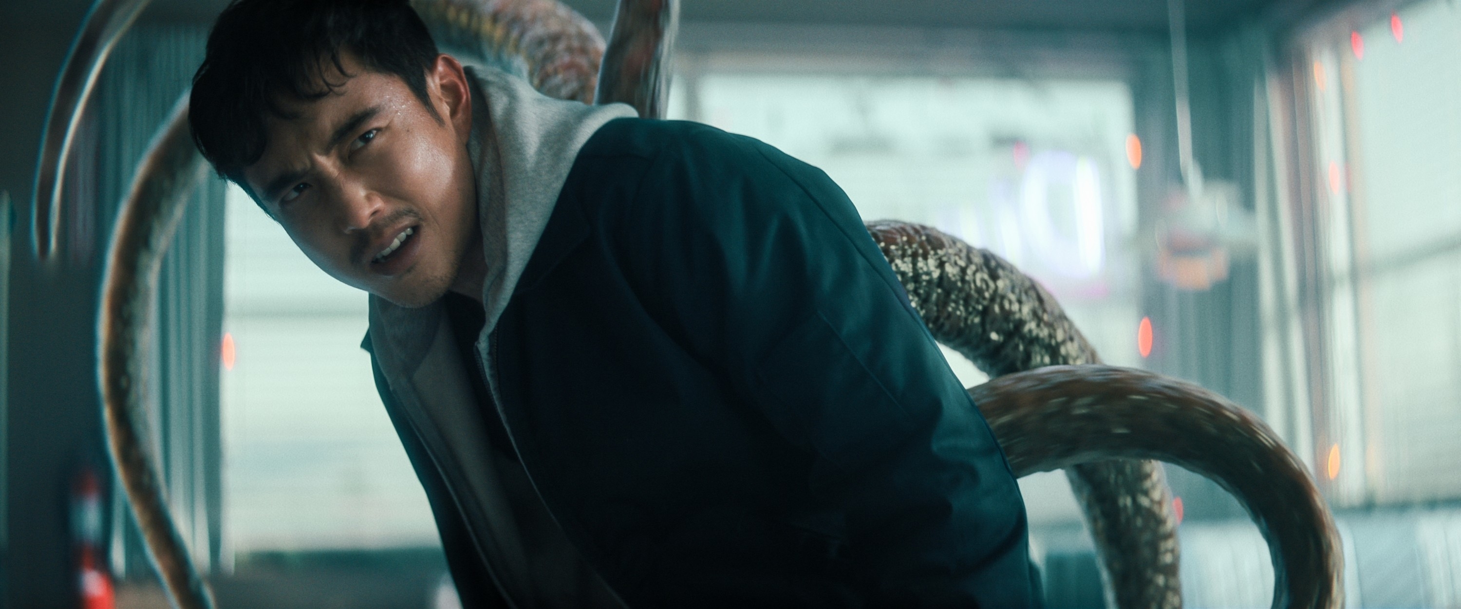 Justin H. Min with tentacles in the background in a scene from "The Umbrella Academy"
