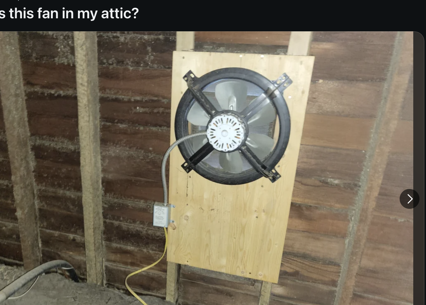 Reddit post by throwawayfain with a photo showing an attic wall with exposed beams. A ventilation fan is mounted on the wall, with a power cord plugged into the outlet below. The post title reads &quot;What is this fan in my attic?&quot;