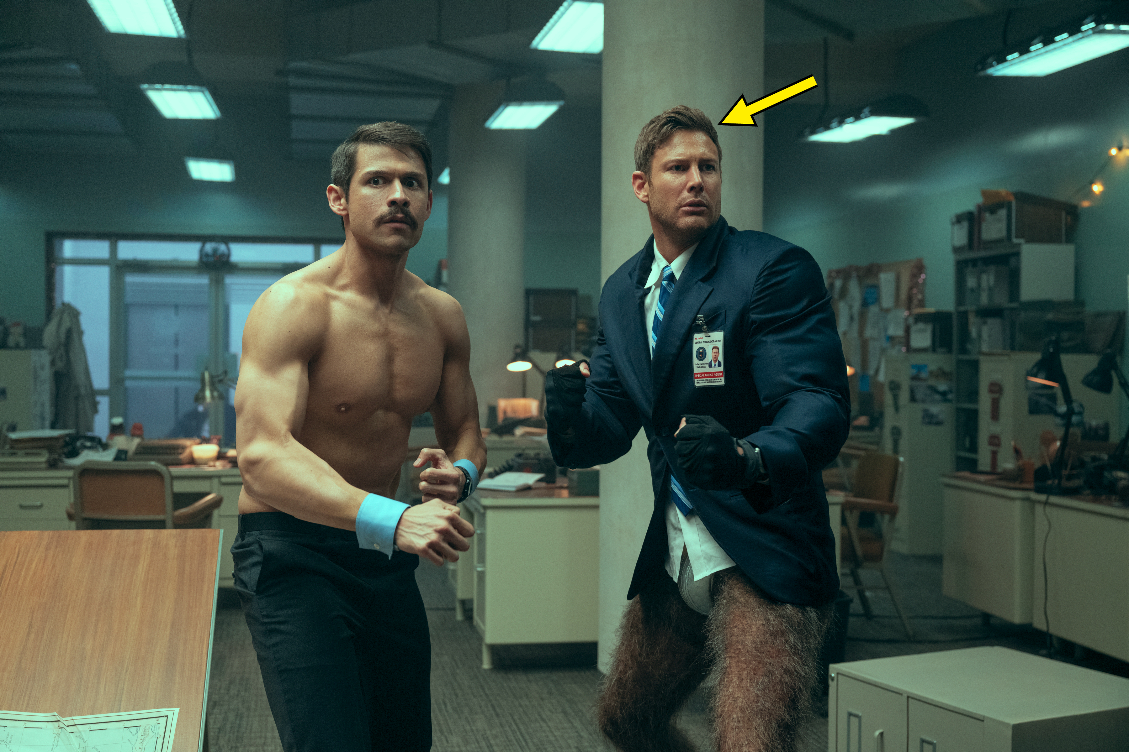 David Castañeda shirtless and and Tom Hopper wearing a formal jacket with his hairy legs exposed in "The Umbrella Academy"