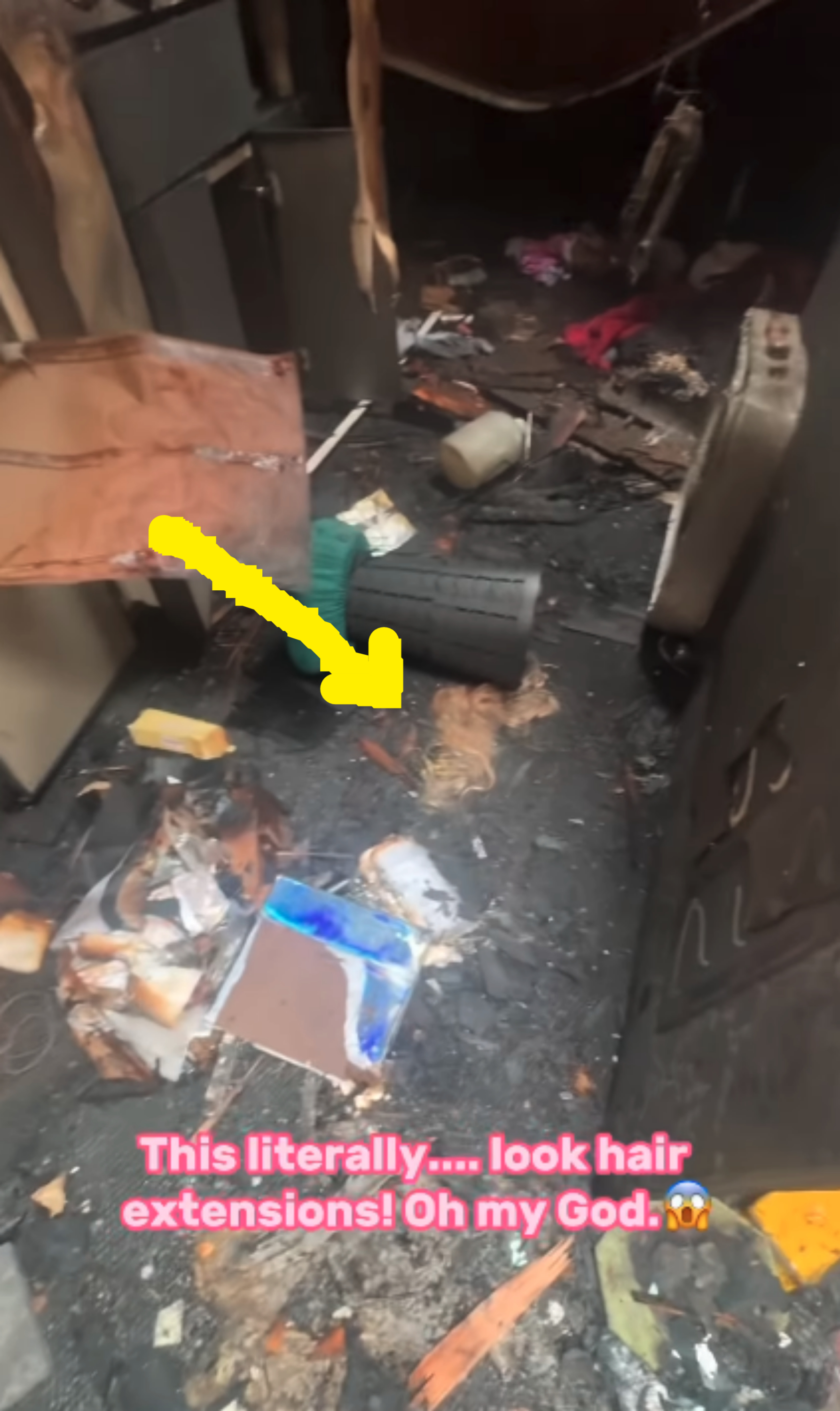 A cluttered, messy room with debris, a burnt section, and visible hair extensions on the floor. Text in the image reads: "This literally….. look hair extensions! Oh my God.?"