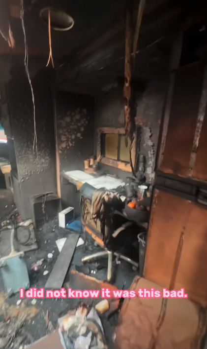 A room with severe fire damage and debris, showing a burnt table, chair, and charred walls. Text at the bottom reads, "I did not know it was this bad."