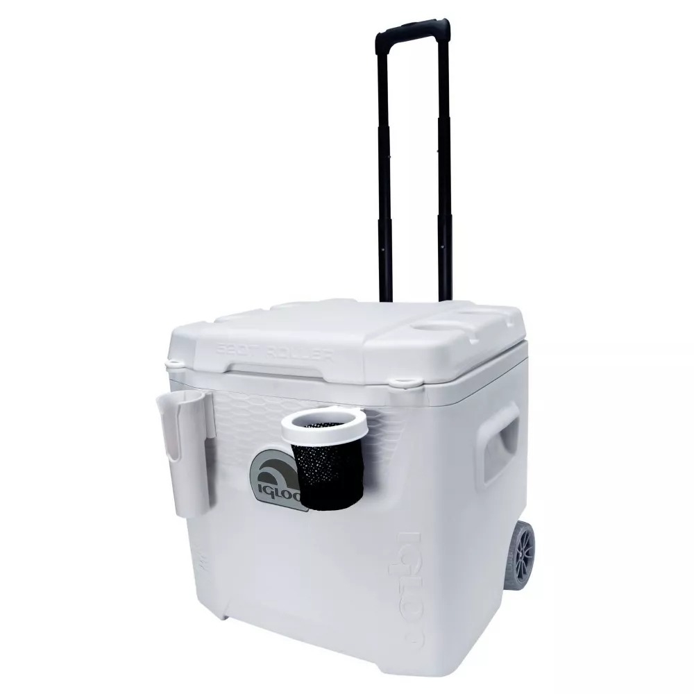 A white Igloo cooler with wheels, a telescoping handle, and a cup holder attachment on the side