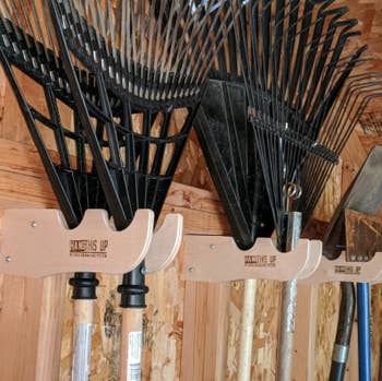 close up of the retention hooks holding rakes