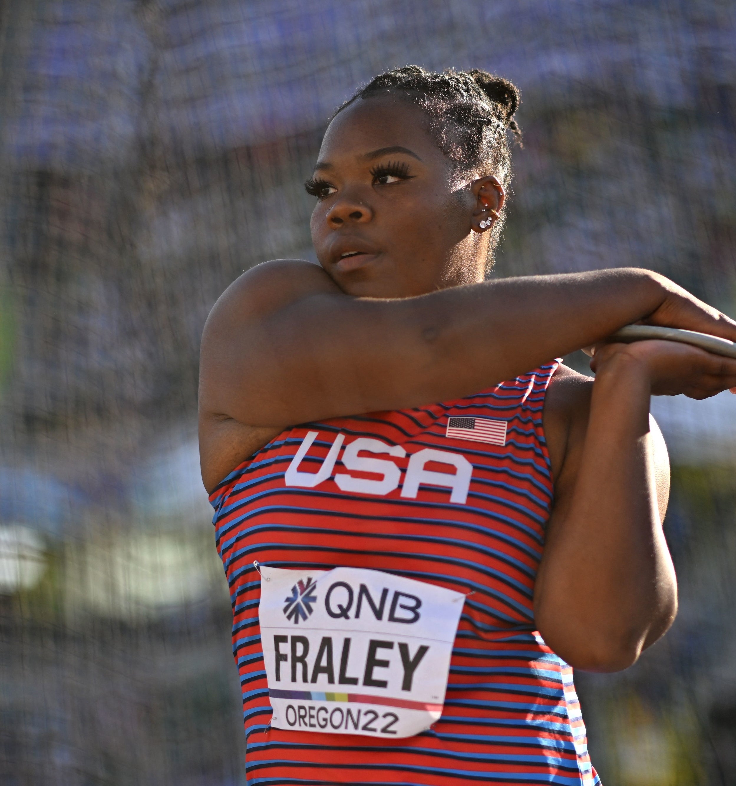 Chase Ealey, wearing a USA sleeveless athletic jersey, prepares for a throw at the World Athletics Championships in Oregon