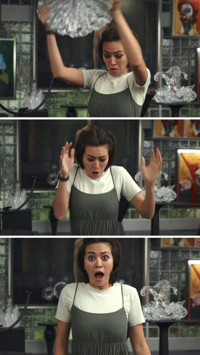 Three-panel sequence showing a person with short hair breaking a glass sculpture. In panel one, they hold the sculpture up. In panel two, it drops. In panel three, they look shocked