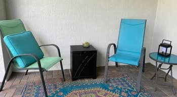 reviewer's 2 patio hairs with the hideaway array successful between, which stores the propane tank