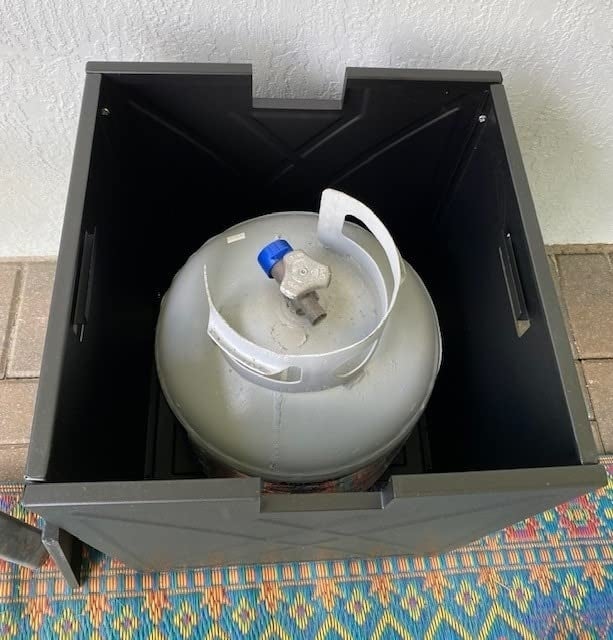 inside the hideaway tank, reviewer shows the propane tank