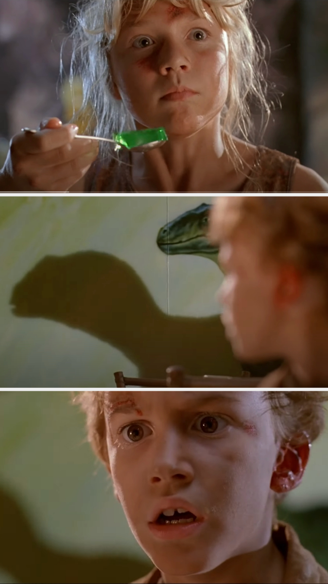 A young girl, Lex Murphy, looks frightened while holding a spoon with green Jello, a dinosaur's shadow approaches her from behind