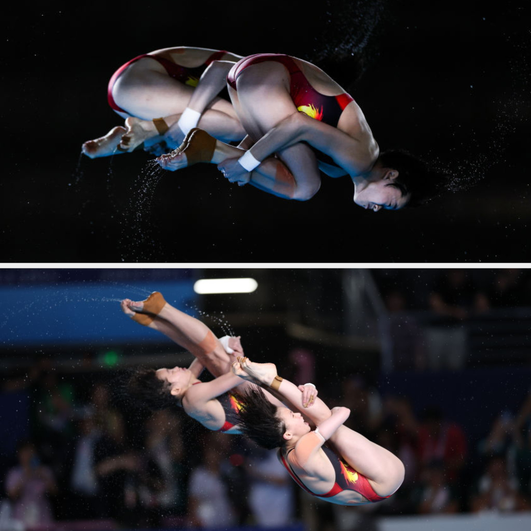 Two synchronized divers perform mid-air flips during a competition. They wear matching swimsuits and are captured in action from two different angles