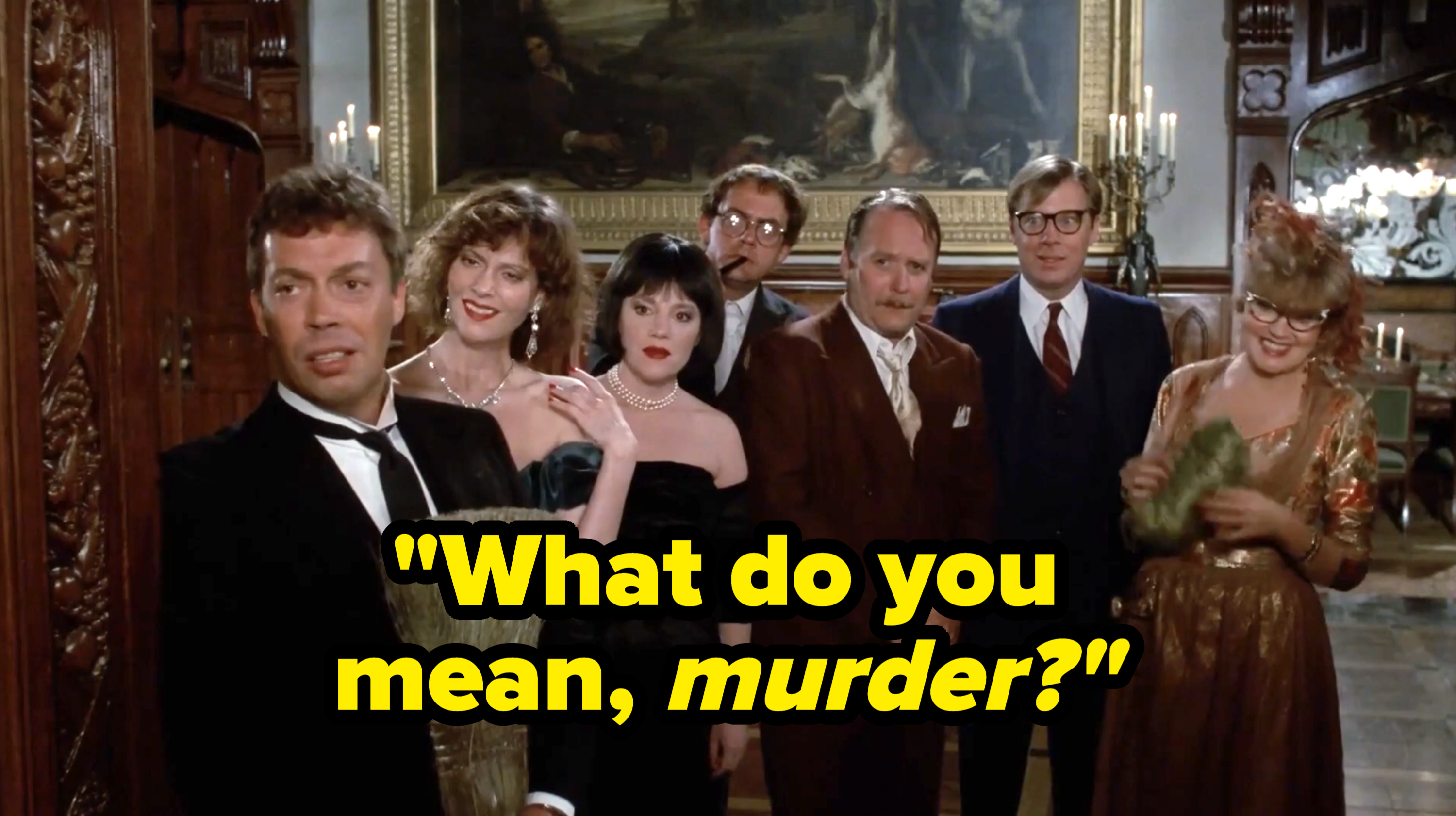 Tim Curry, Lesley Ann Warren, Madeleine Kahn, Christopher Lloyd, Michael McKean, Martin Mull, and Eileen Brennan dressed in formal attire in a fancy room