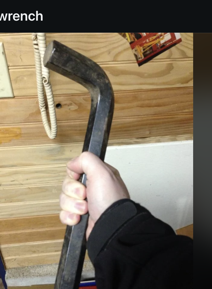 A hand holding a large Allen wrench is displayed on a Reddit post titled "The size of this allen wrench" from the subreddit r/mildlyinteresting