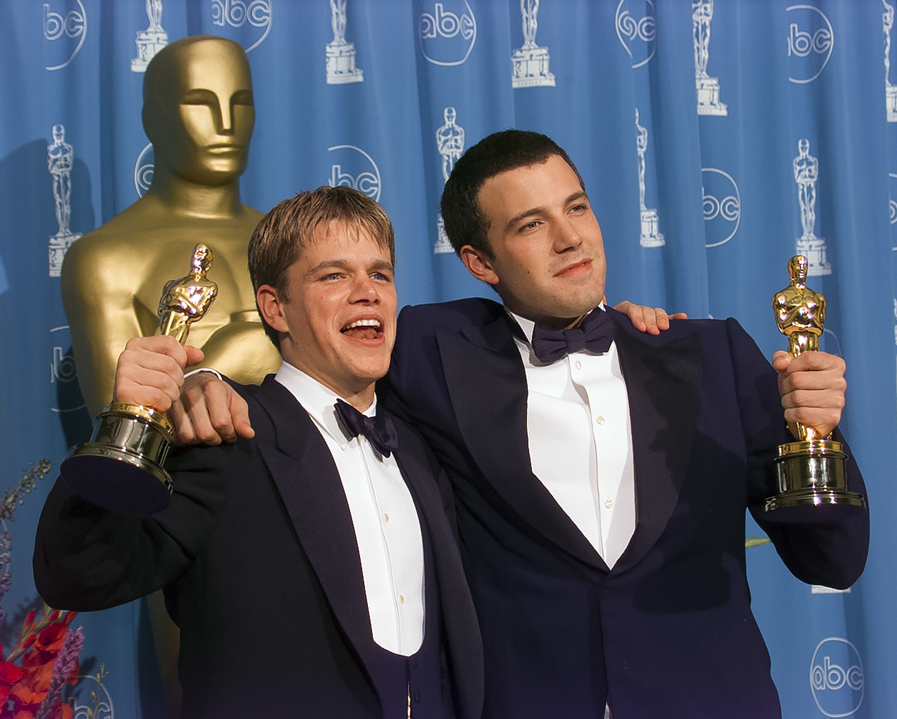 Matt Damon and Ben Affleck pose with their Oscars backstage