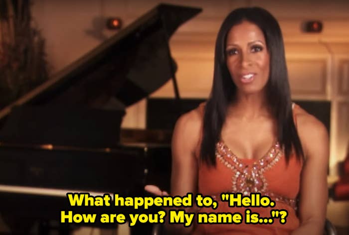 Sheree Whitfield, wearing a sleeveless embellished top, speaks while seated in front of a grand piano. Text: &quot;What happened to, 'Hello. How are you? My name is&hellip;'?&quot;