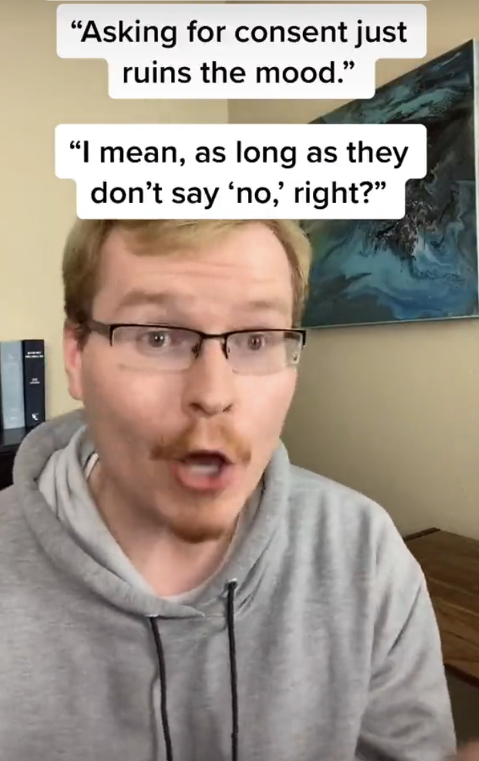 A person wearing glasses and a hoodie reacts with shock or surprise to two captions: "Asking for consent just ruins the mood." and "I mean, as long as they don’t say 'no,' right?"