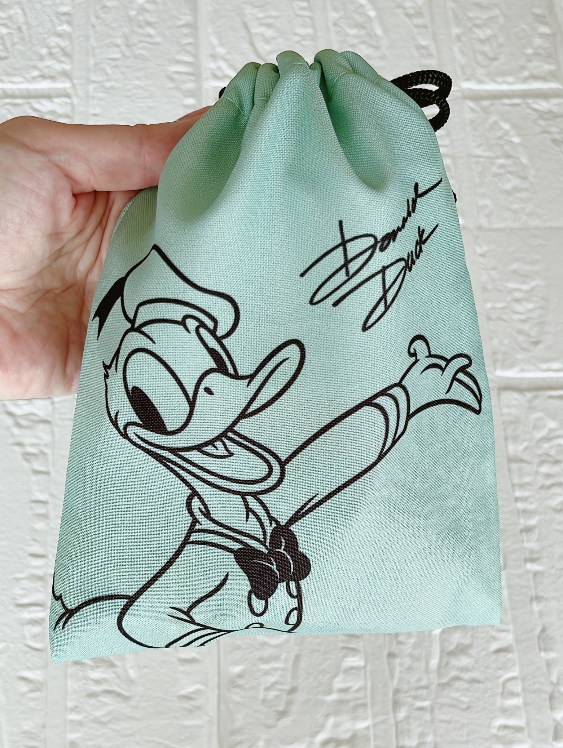 キャンドゥのおすすめ雑貨「ディズニー/巾着 ドナルド グリーン」