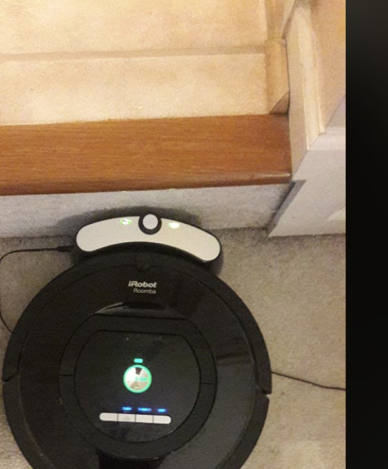 Screenshot of a Reddit post by u/f-frugal showing a $9 thrift store Roomba with a $20 charging station, accompanied by praise for the deal