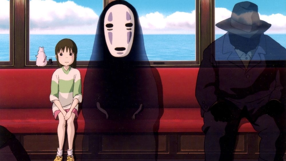 Chihiro and No-Face sit on a red bench in a train from the animated film "Spirited Away". A small creature is perched by Chihiro. An unknown silhouetted figure is seated to the right
