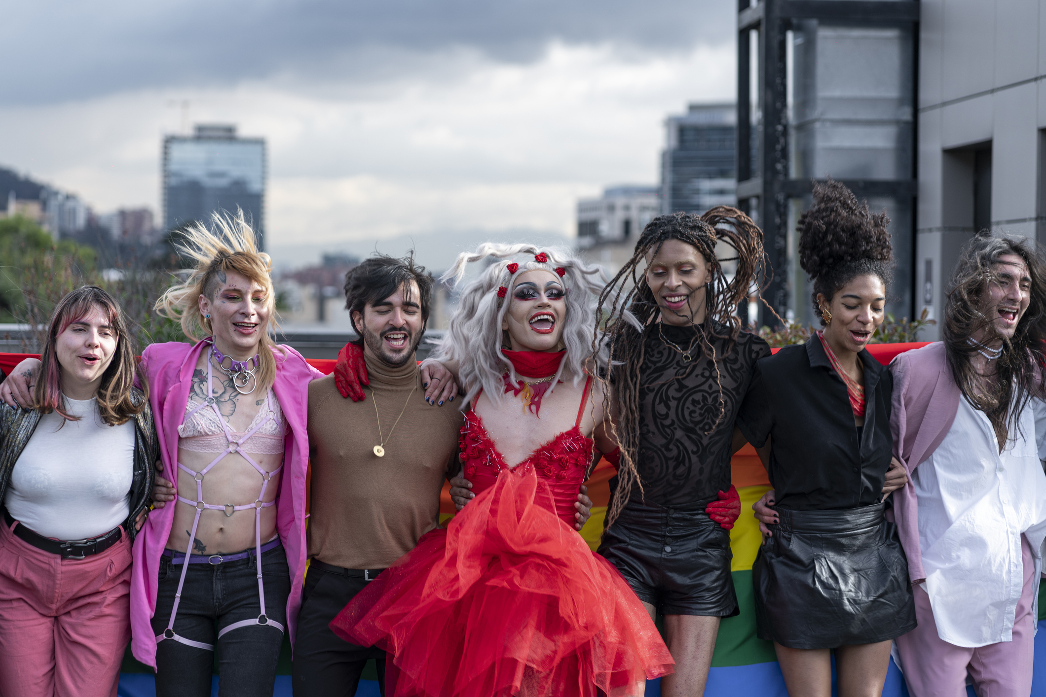 Group photo of eight people on a rooftop.