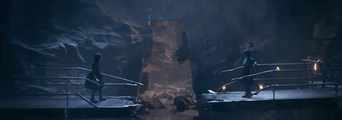 Two characters face each other on separate metallic platforms in a dark, cave-like setting, preparing for a confrontation