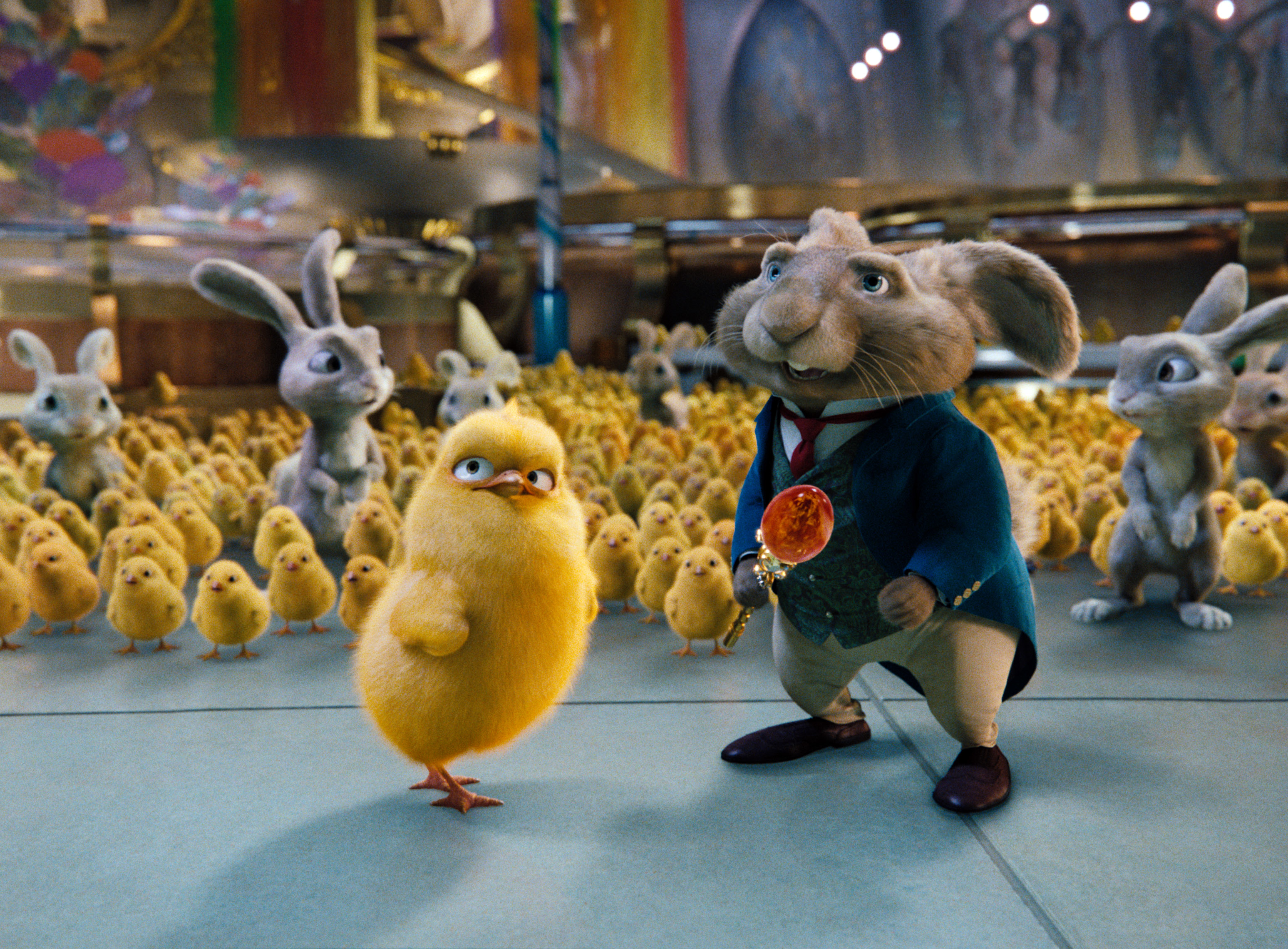 E.B., a rabbit in a blue blazer, stands with Carlos, a yellow chick, amidst a crowd of bunnies and chicks from the movie &quot;Hop.&quot;
