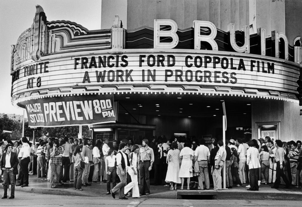 Crowd outside a theater under a marquee that reads, &quot;Francis Ford Coppola Film - A Work in Progress - Preview 8:00 PM.&quot;