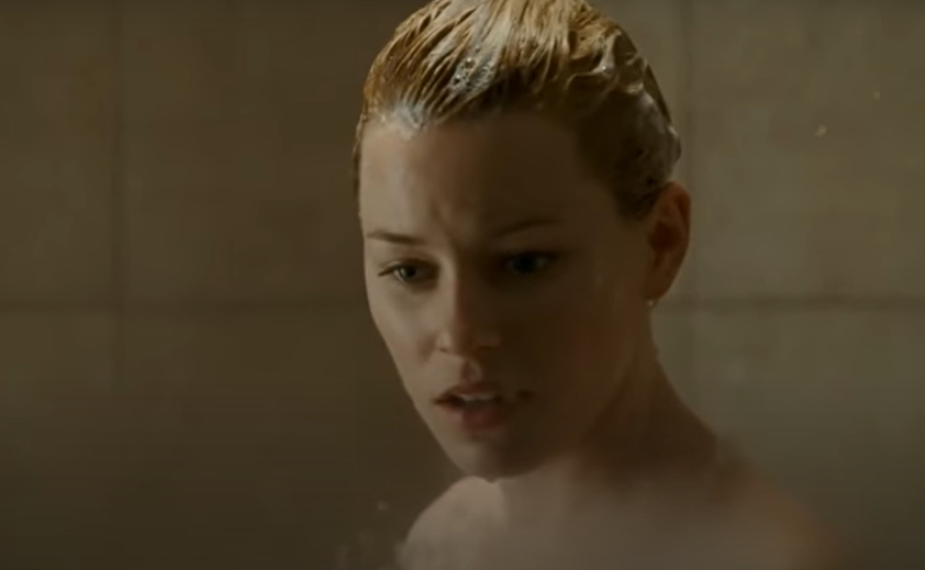 Elizabeth Banks in a shower scene with a worried expression from Slither