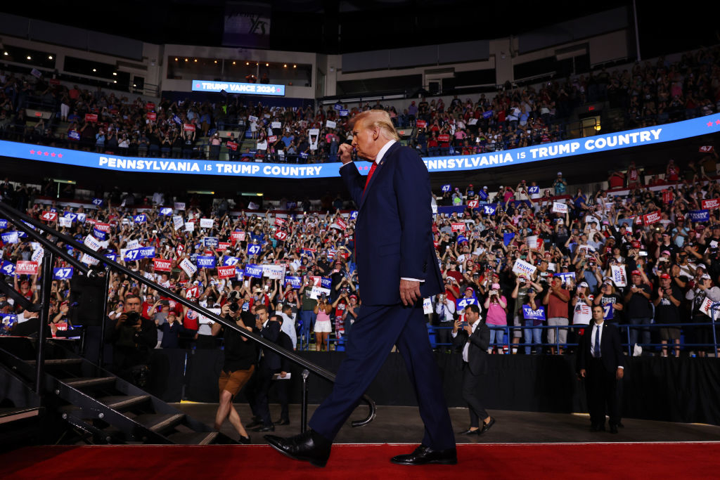 Donald Trump walks on stage at a rally in Pennsylvania