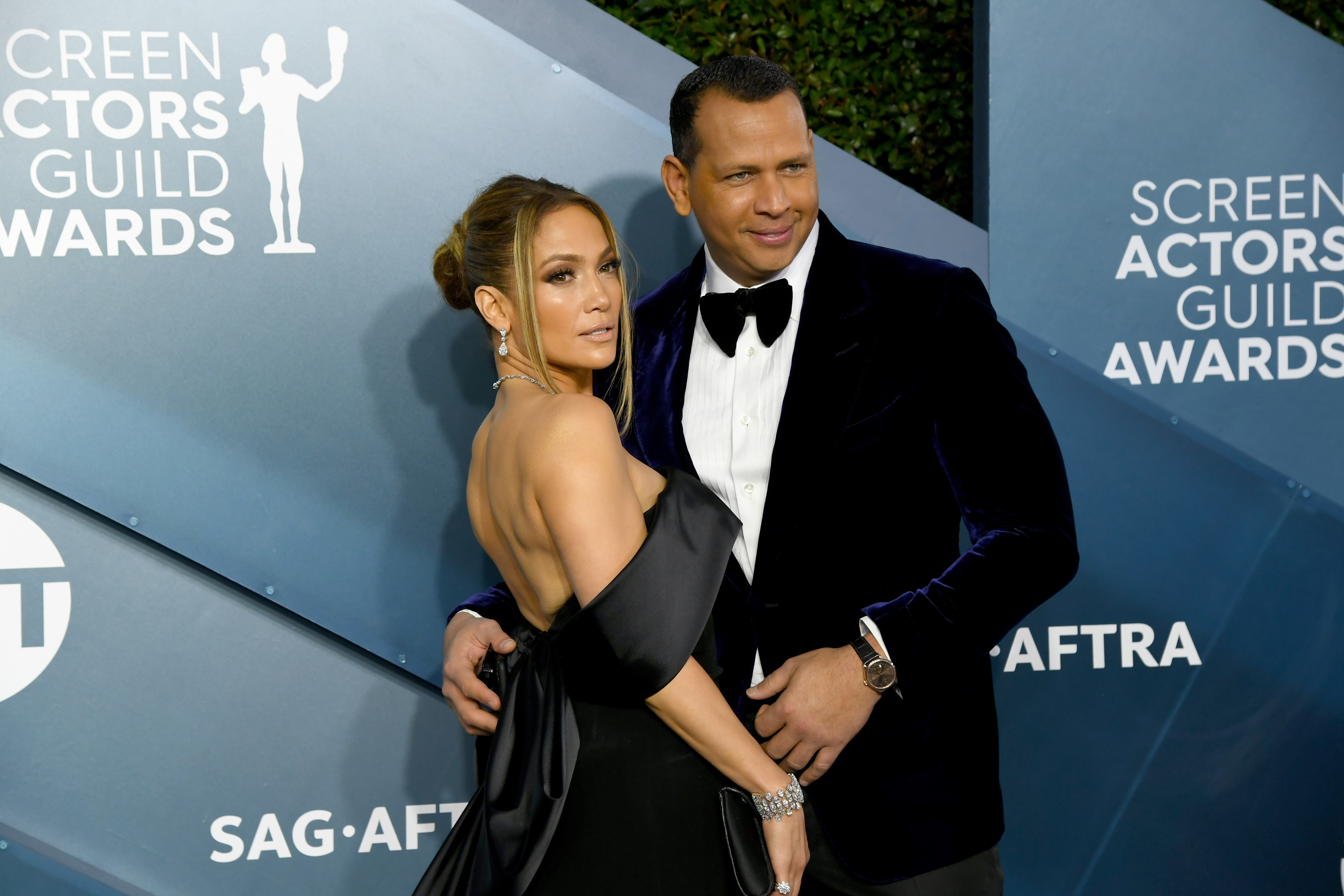 Jennifer Lopez in a backless black gown and Alex Rodriguez in a velvet tuxedo on the red carpet at the Screen Actors Guild Awards