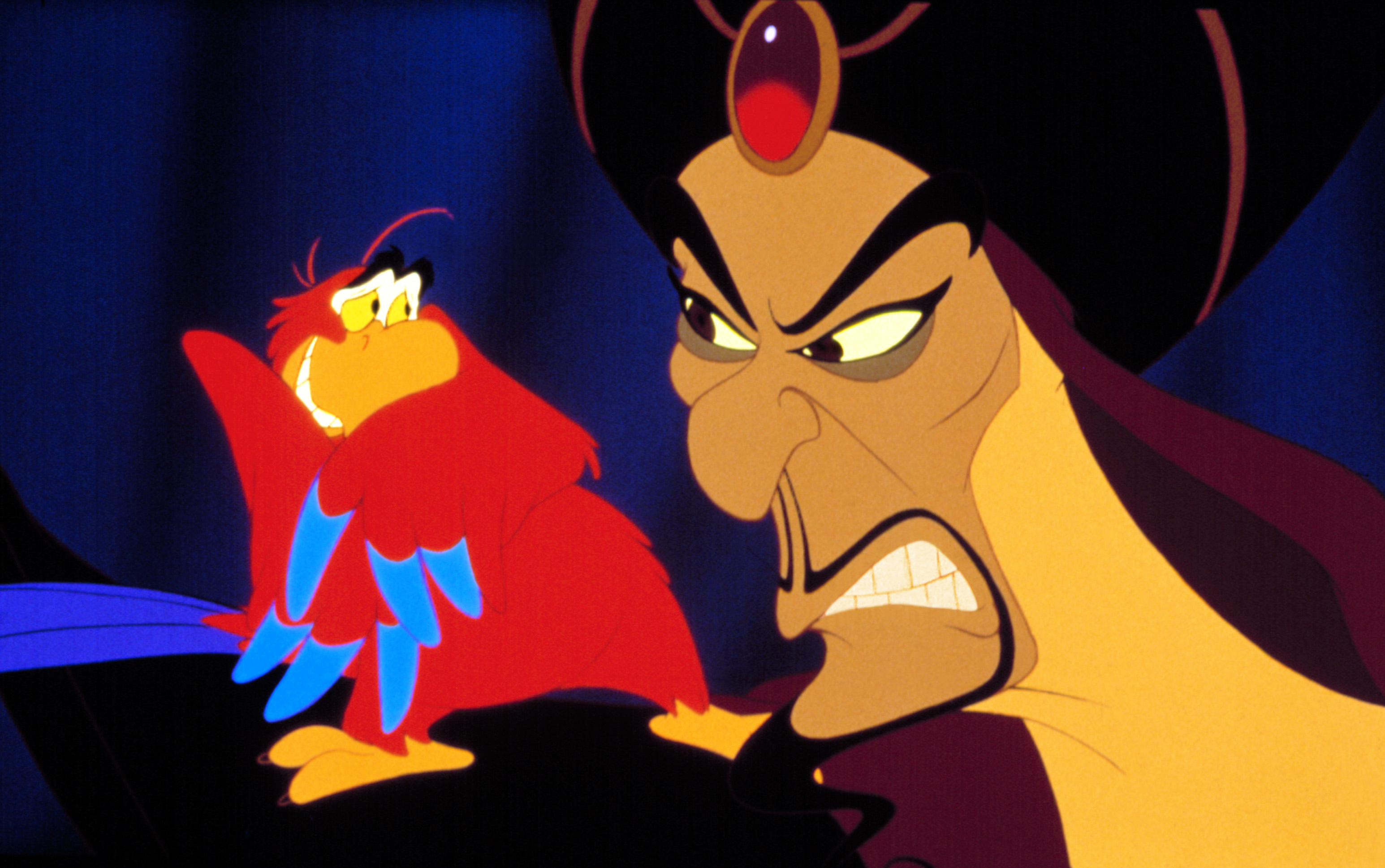 Jafar, with an angry expression, and Iago, appearing startled, from Disney's Aladdin