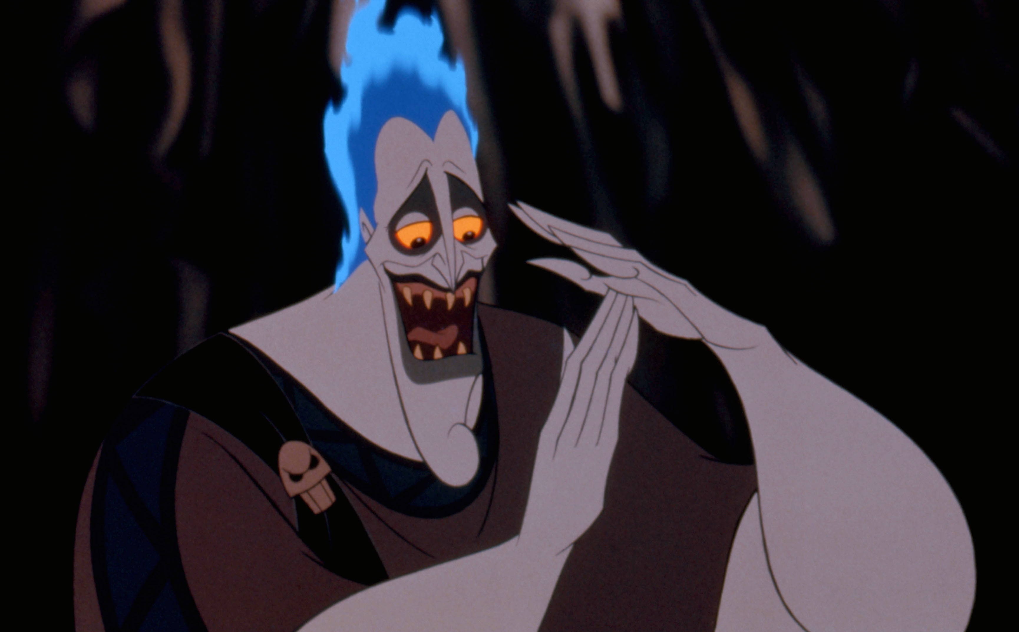 Hades from Disney's Hercules claps his hands, appearing to laugh or mockingly devise a plan, with his blue flame hair standing out