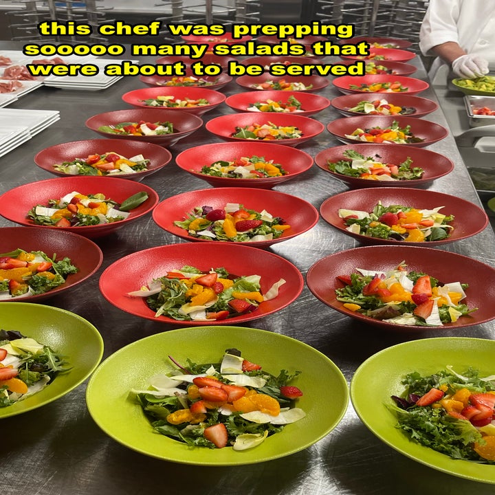 A chef prepares multiple bowls of salads with various vegetables in a kitchen. The image text reads, "this chef was prepping sooooo many salads that were about to be served."