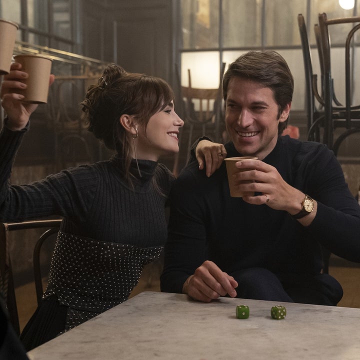 Lily Collins and Lucas Bravo smile and toast with coffee cups in a cozy cafe scene in "Emily in Paris" Season 4