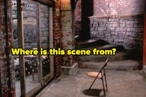 A dim, rustic room with stone and brick walls, featuring a single wooden chair and a glass door. Text on the image asks, "Where is this scene from?"