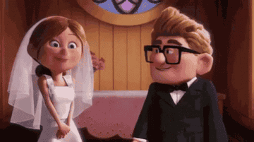 Animated characters Ellie and Carl from "Up" share a joyful moment in their wedding attire. Ellie wears a wedding dress and veil, and Carl is in a suit and bowtie