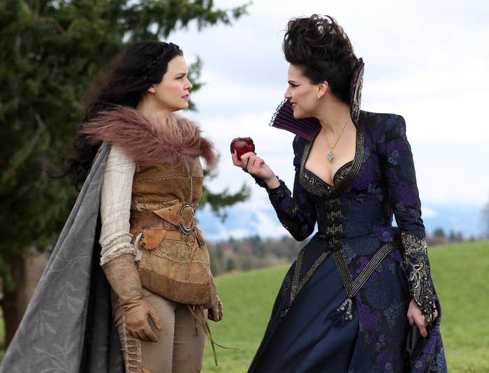 Ginnifer Goodwin and Lana Parrilla in a dramatic scene from &quot;Once Upon a Time.&quot; Ginnifer's character has medieval attire, and Lana's character holds a red apple, wearing ornate clothing