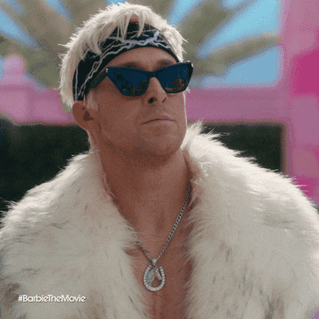 Ryan Gosling wears sunglasses, a headband, a fur coat, and a chain necklace. The hashtag in the image reads #BarbieTheMovie