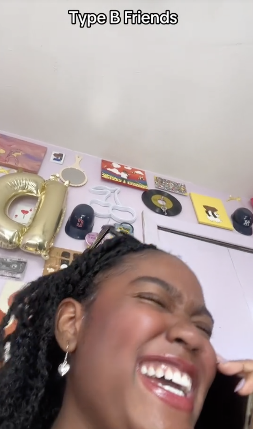 Dionna laughing while on the phone, with "Type B Friends" text above. The background has various decorations, including balloons and hats