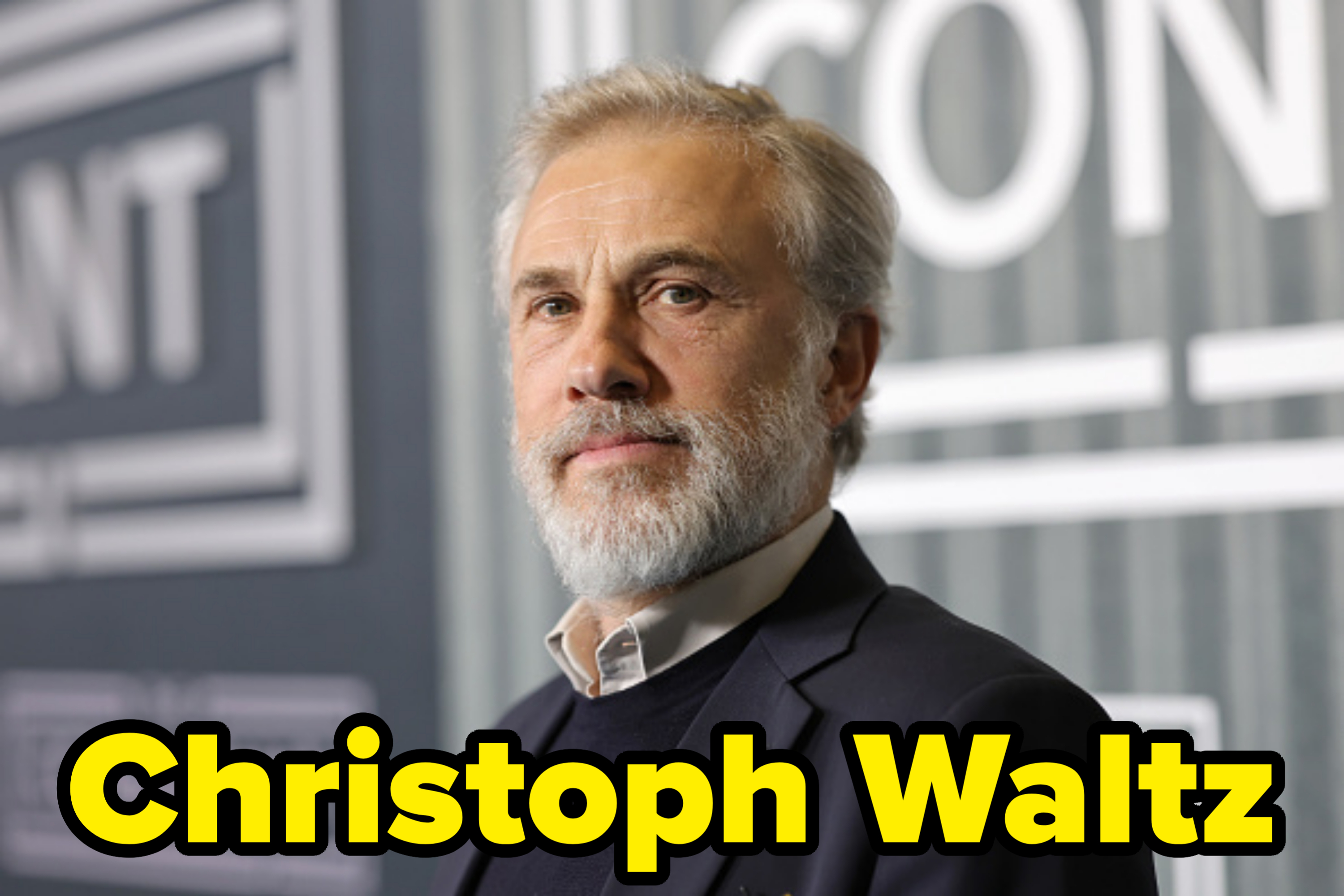 Christoph Waltz in a suit jacket and shirt at an event