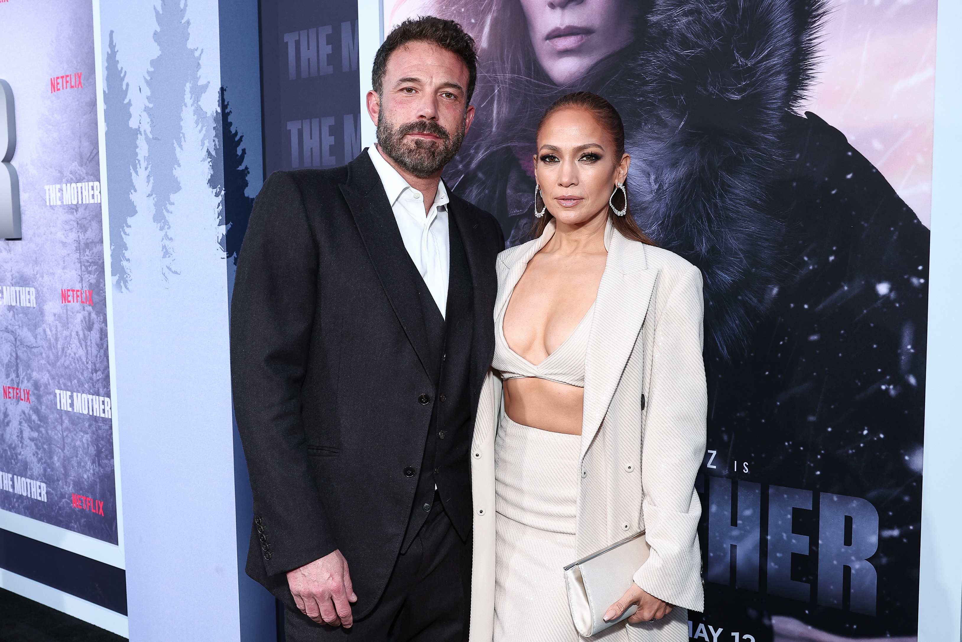 Ben Affleck in a suit and Jennifer Lopez in a stylish two-piece outfit with a long coat at the premiere of "The Mother."